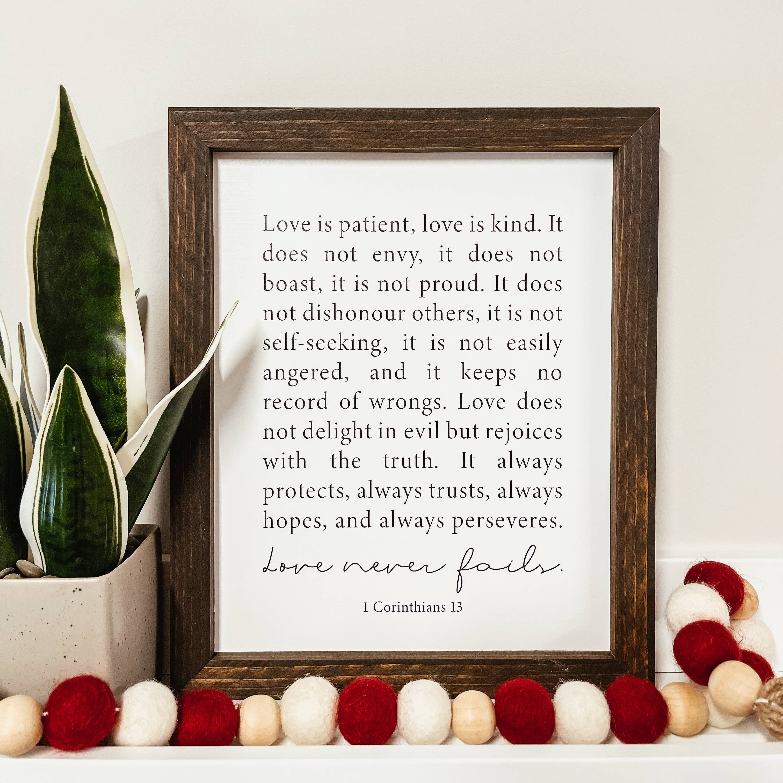 Love Never Fails Framed Wood Sign